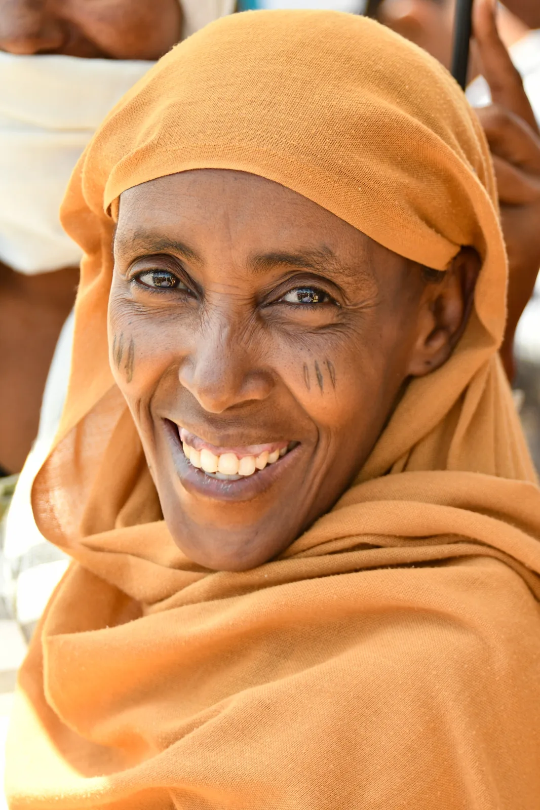 Woman smiling at a Gospel gathering