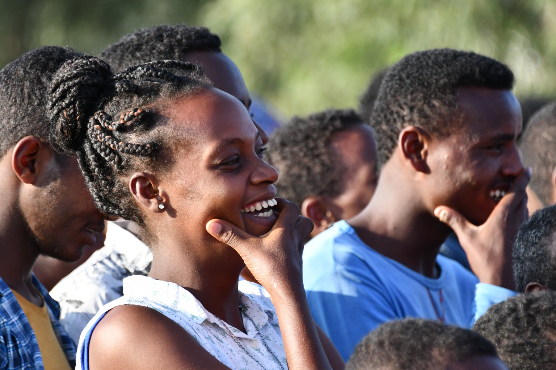 Joyful people listening at a Gospel crusade