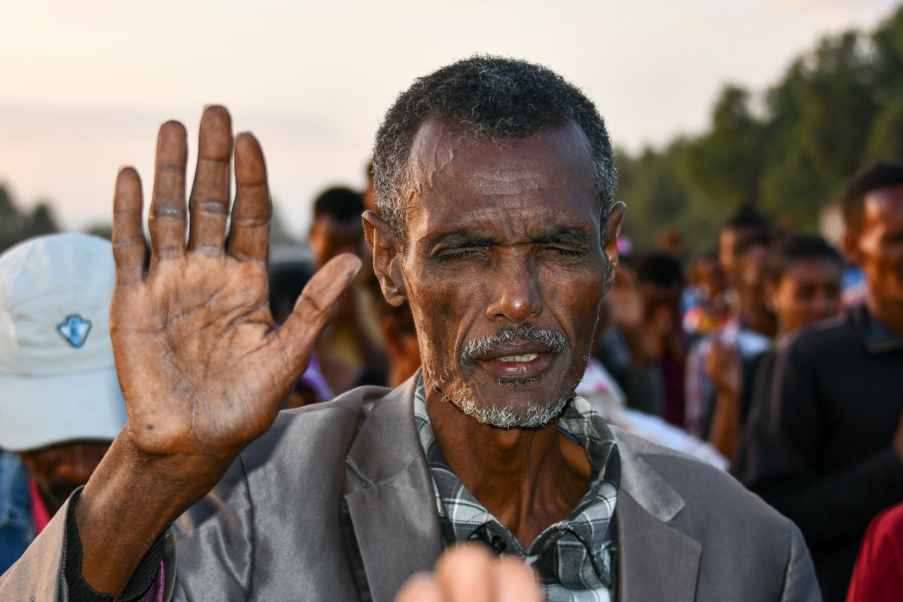 Man responding in prayer at a Gospel crusade