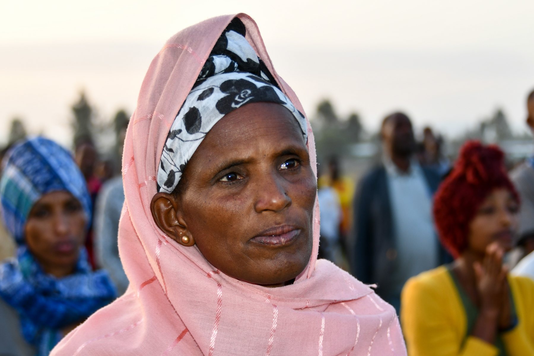 Woman smiling at a Gospel crusade