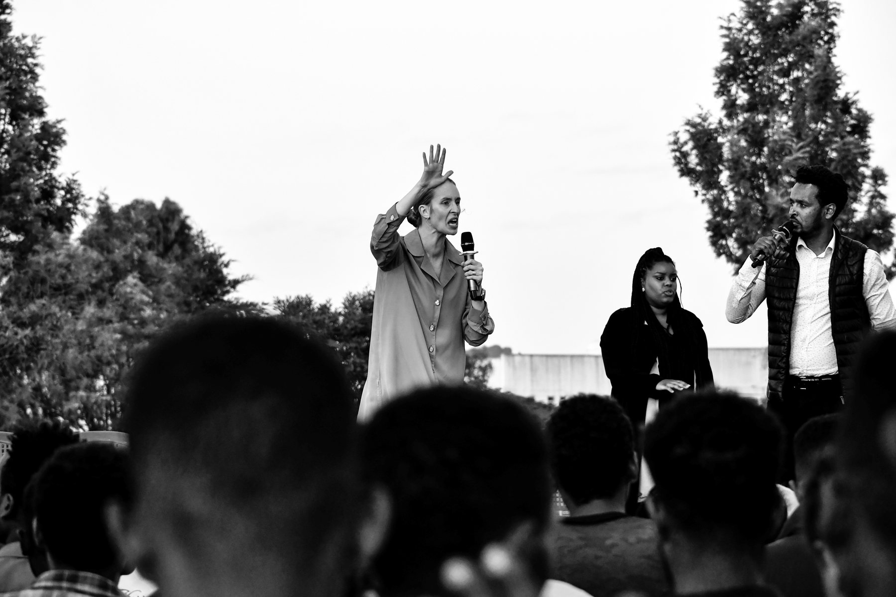 Tamryn speaking at an outdoor ministry event