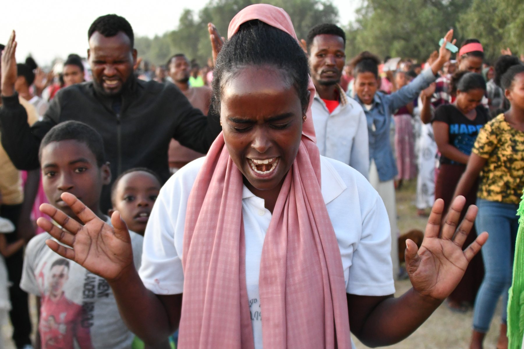 Man responding in prayer at a Gospel crusade