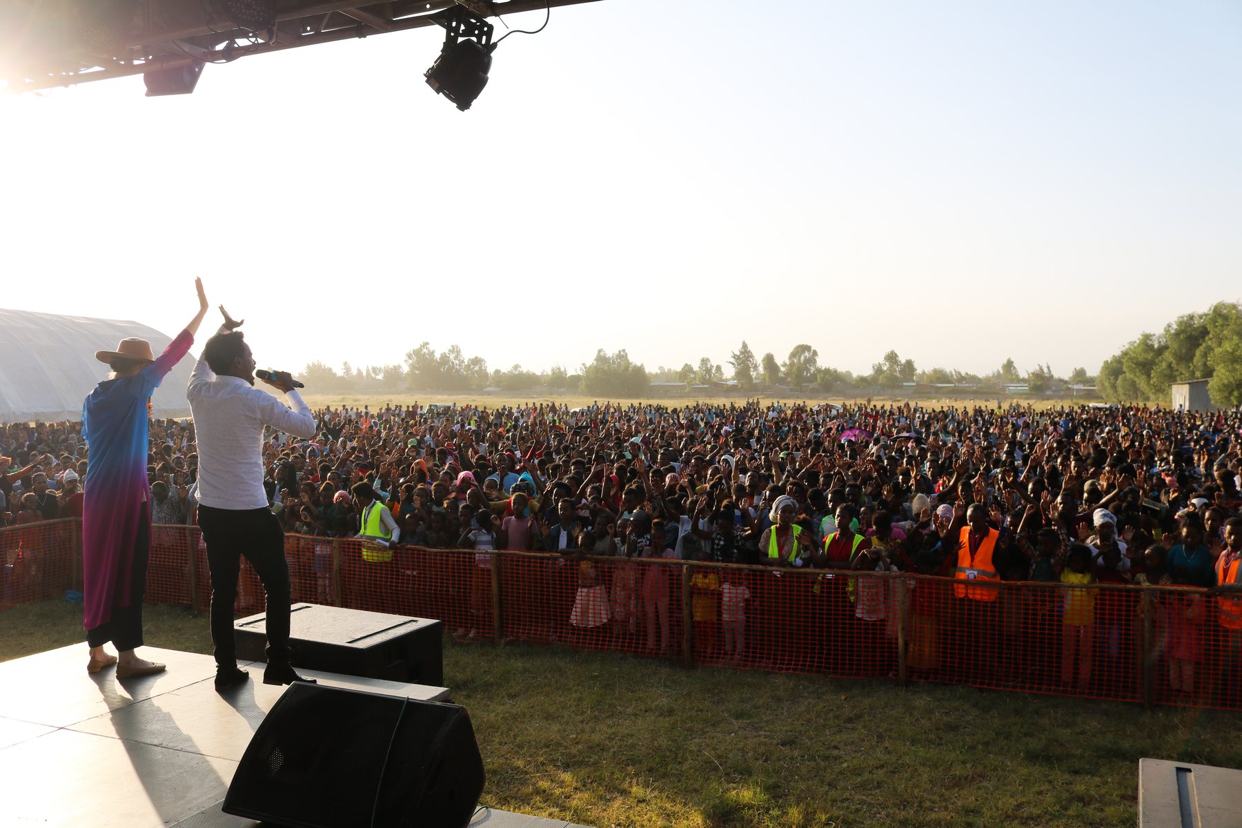 Stage and crowd at sunset