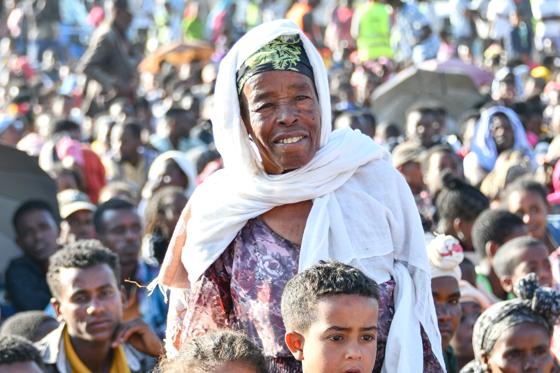 Mother and child in a local field crusade crowd